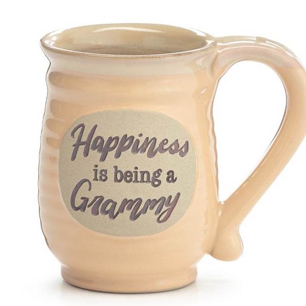 Beige ceramic mug with the phrase 'Happiness is being a Grammy' printed on the front.