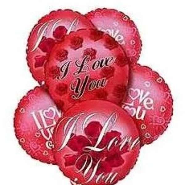 Cluster of red heart-shaped balloons with love messages