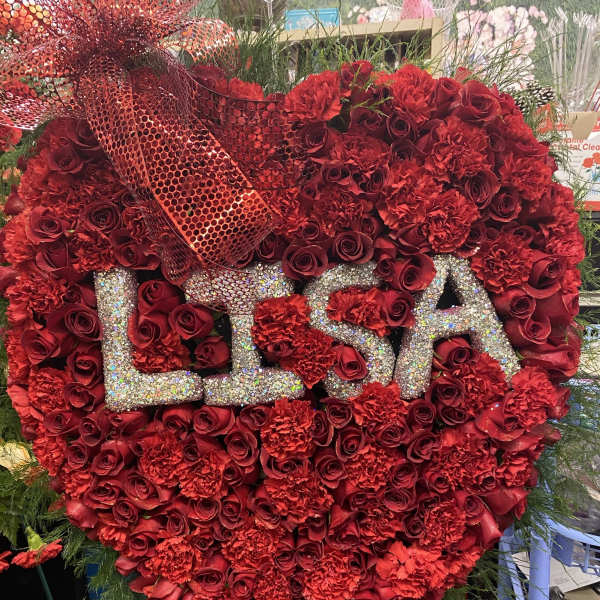 Heart-shaped red rose and carnation arrangement with glitter letters