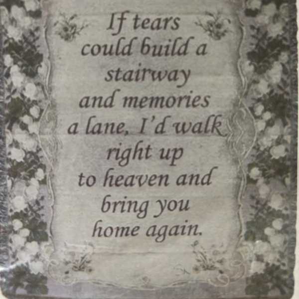 Decorative memorial sign with floral border and a sympathy quote