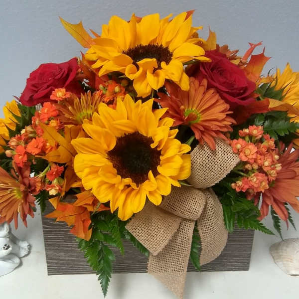 Sunflower and rose arrangement in a rectangular box with burlap ribbon