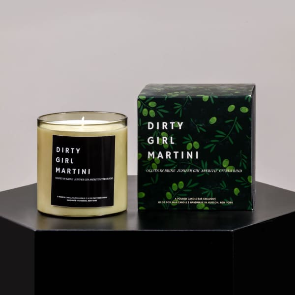 Scented candle in a glass jar beside its matching box