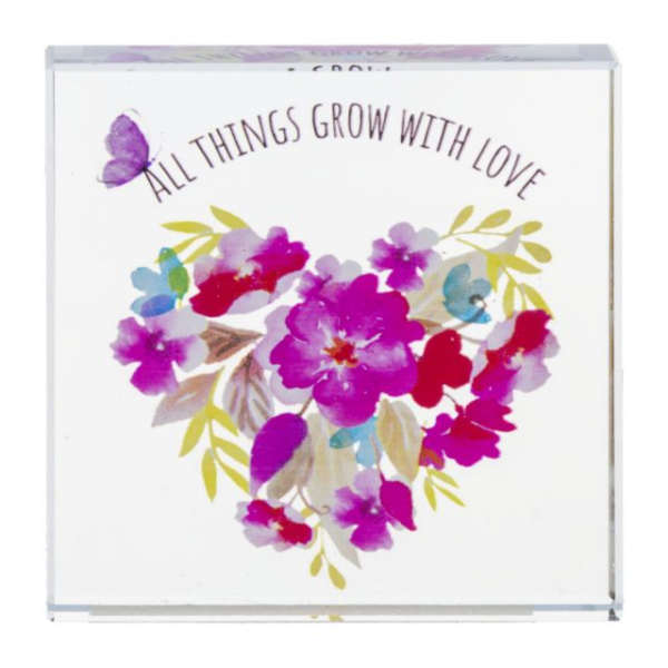Decorative card with a floral heart and the words "All Things Grow With Love"
