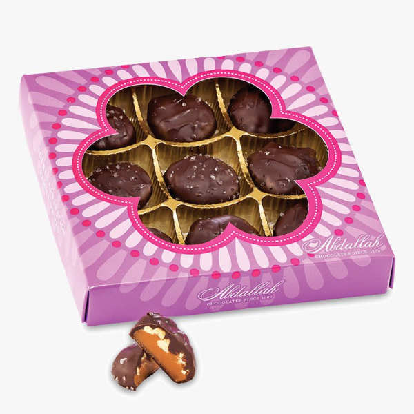 Box of chocolate-covered candies in a pink floral-patterned package