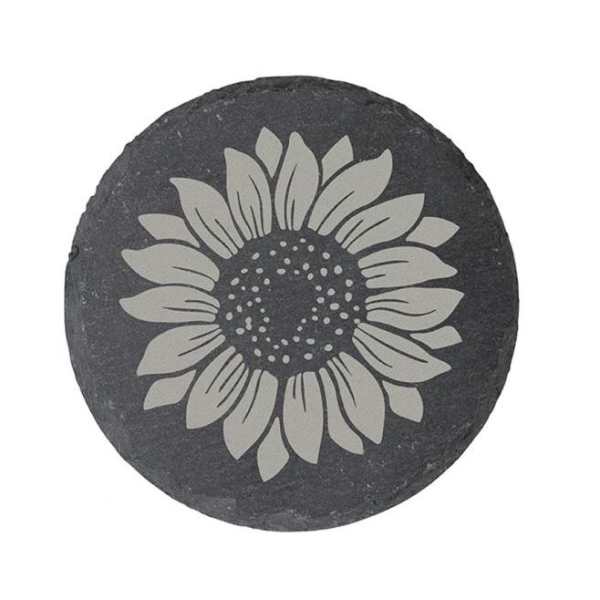 Round black stone with a white sunflower design