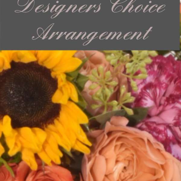 Mixed bouquet with roses, a sunflower, and pink carnations