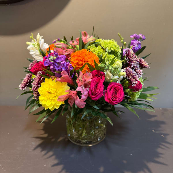 Colorful mixed bouquet in a clear glass vase