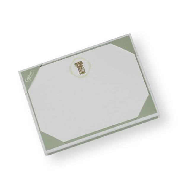 A white and pale green gift box with a decorative logo