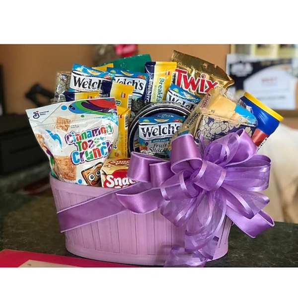 Purple gift basket filled with assorted snack packs and tied with a ribbon