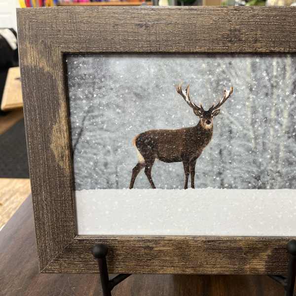 Framed winter scene of a deer standing in snow