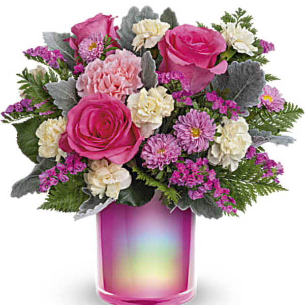 Pink roses and carnations in a rainbow glass vase