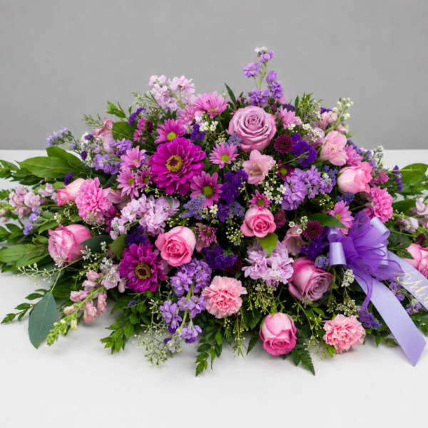 Compassionate Lavender Blooms Casket Spray