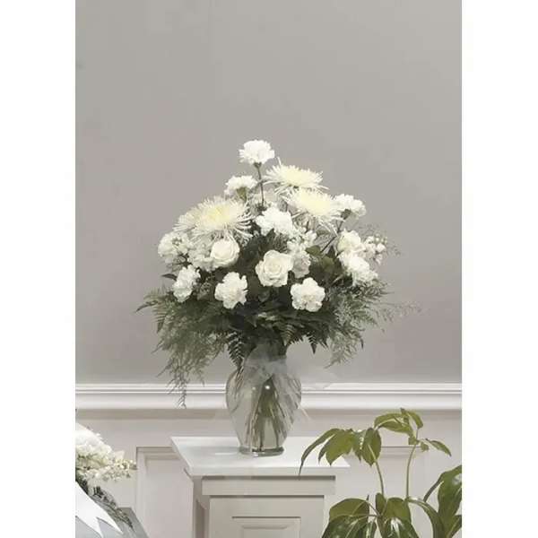 White floral arrangement in a clear glass vase