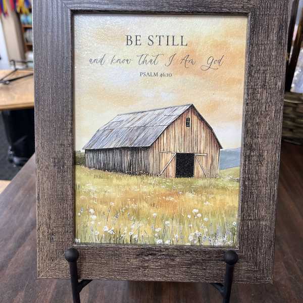 Framed barn print with the words "Be Still and know that I am God"
