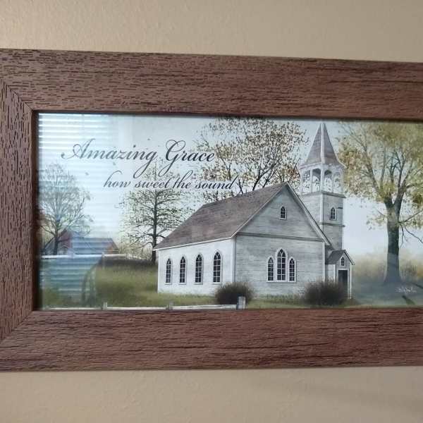 Framed wall art of a white church with the words Amazing Grace