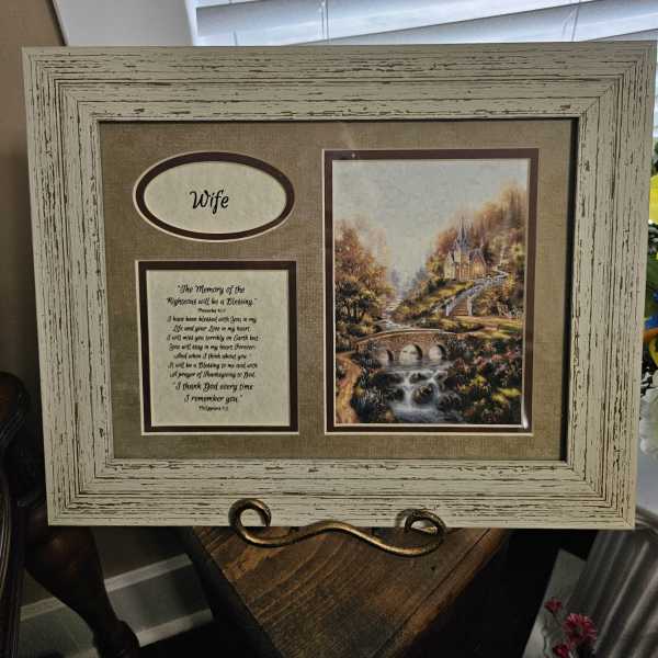 Framed memorial display with a landscape print and the word Wife