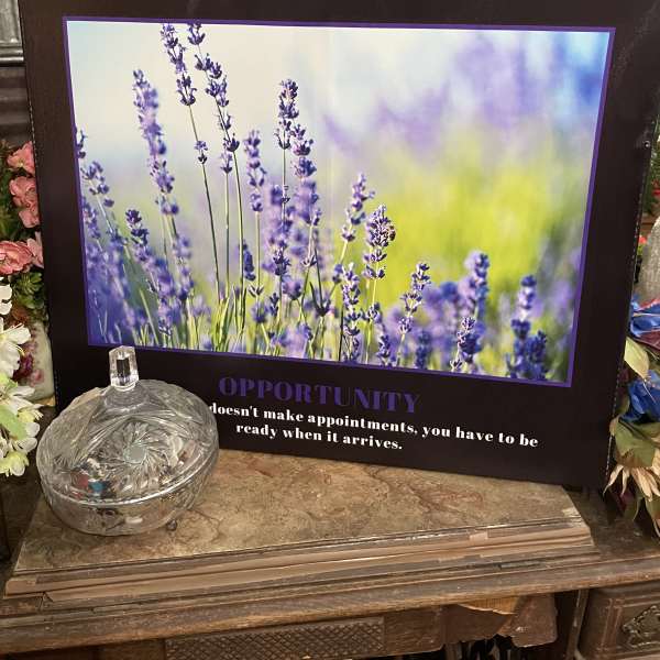 Framed lavender flower print with a glass dish in front