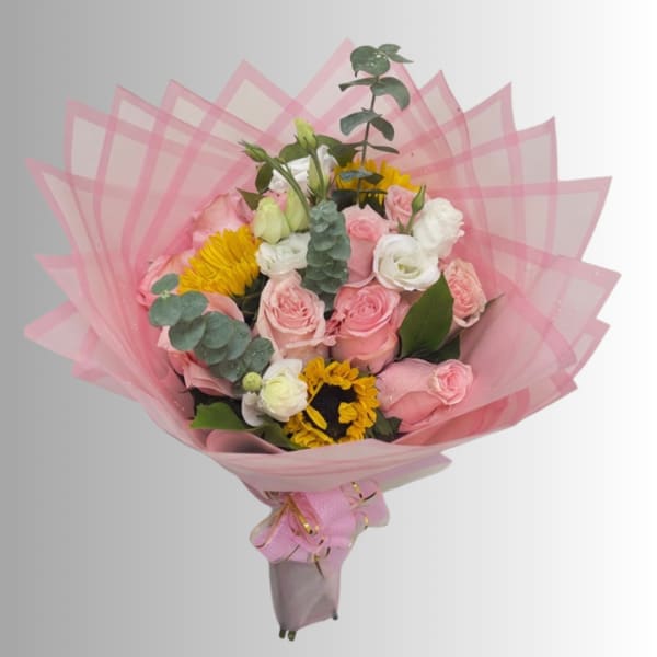 Pink and white rose bouquet with yellow flowers wrapped in pink paper