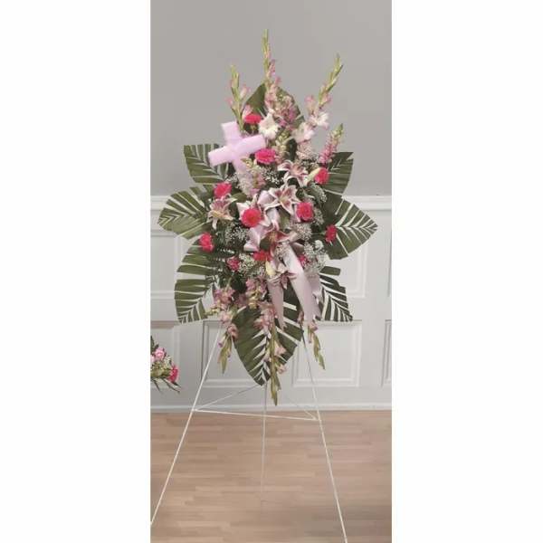 Tall pink and white floral standing spray on an easel