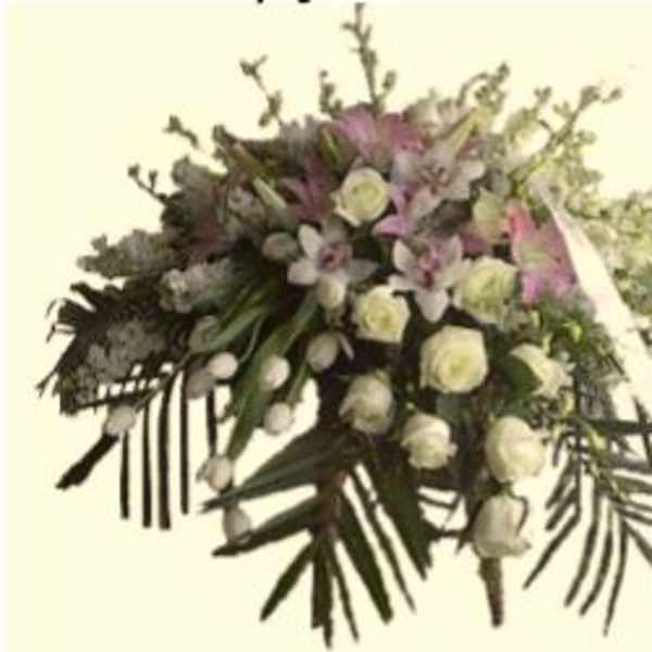Large white and pink floral spray with cascading greenery