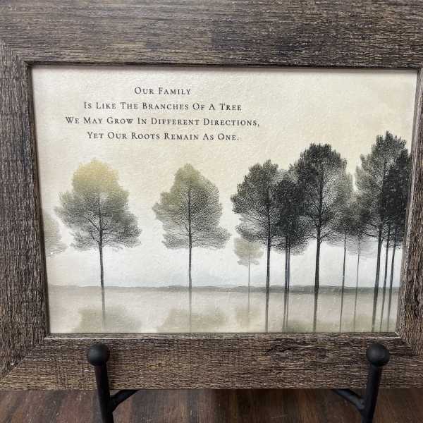 Framed tree artwork with a family quote on a stand