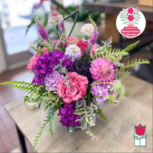 Bouquet of pink, purple, and white flowers in a vase