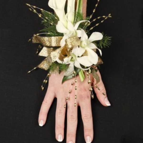 White calla lily wrist corsage with gold ribbon and bead accents