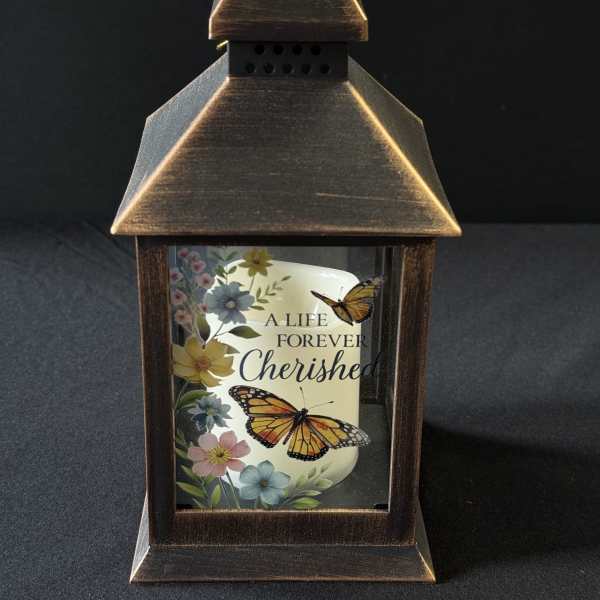 Decorative lantern with a memorial candle and butterfly floral print