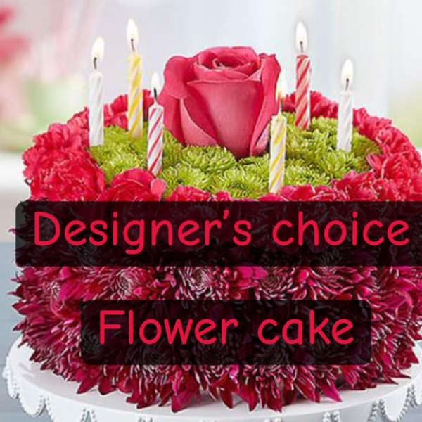 Flower cake with a pink rose and striped candle picks
