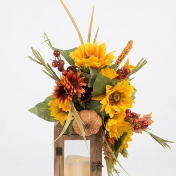 Sunflower arrangement in a wooden lantern with a candle inside