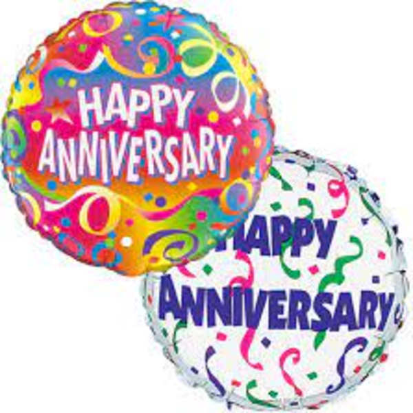Two anniversary balloons with colorful confetti patterns