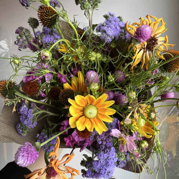 Mixed bouquet with yellow daisies and purple flowers