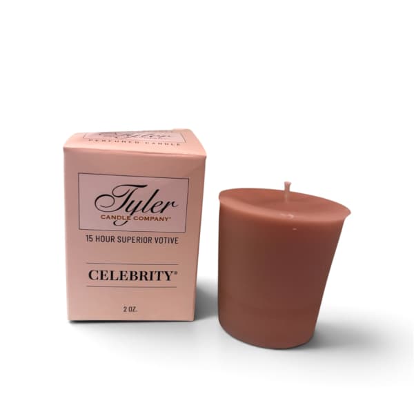 Pink boxed votive candle beside a brown candle