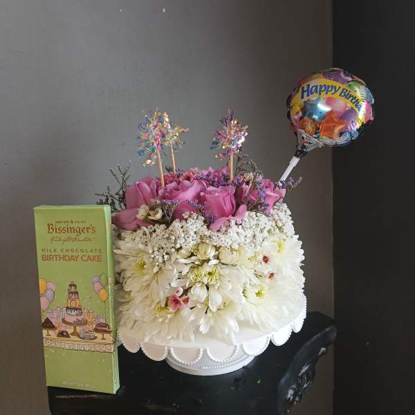 Birthday flower arrangement with a balloon and chocolate box