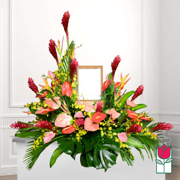 Large tropical floral arrangement with pink anthuriums and red ginger flowers