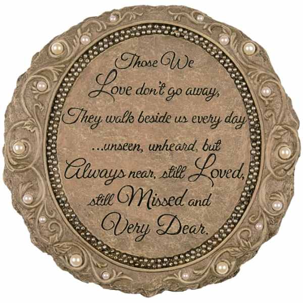 Round memorial plaque with a sympathy quote and pearl-like accents
