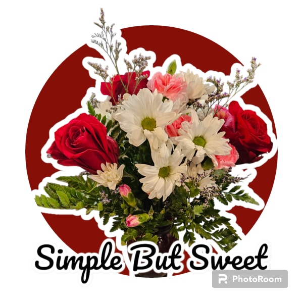 Bouquet of red roses, white daisies, and pink carnations