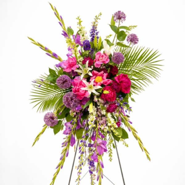 Tall standing floral spray with pink, purple, and white flowers