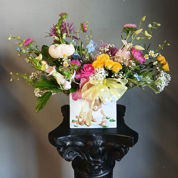 Colorful mixed bouquet in a white gift box with a yellow ribbon