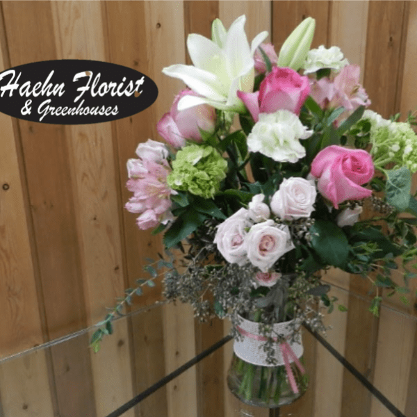 Pink and white mixed bouquet in a glass vase