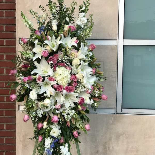 Tall standing floral spray with white lilies and pink roses