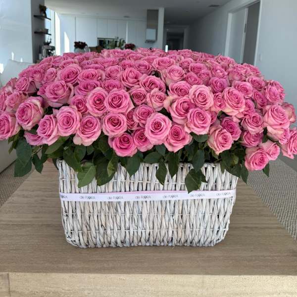Large basket arrangement of pink roses