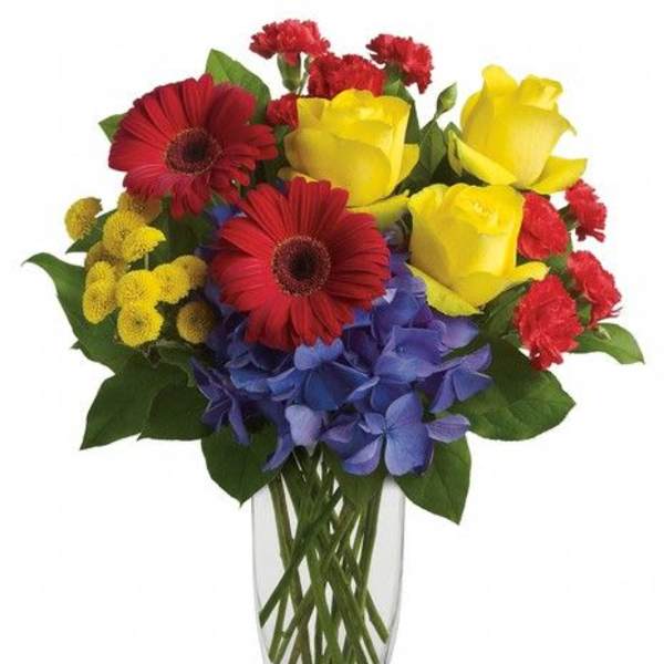 Bouquet of red and yellow flowers in a clear glass vase