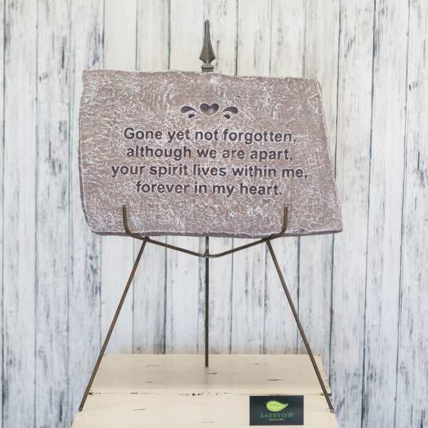 Memorial plaque on a metal stand with a sympathy message