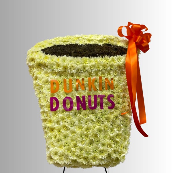Flower-covered Dunkin Donuts display with an orange ribbon bow