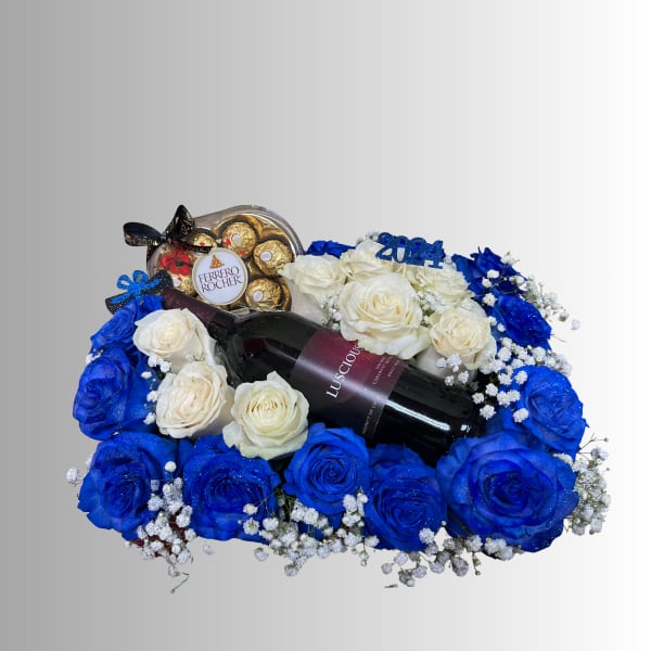 Blue and white rose arrangement with a wine bottle and chocolates