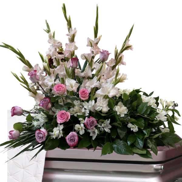 Pink and white floral spray on a silver casket