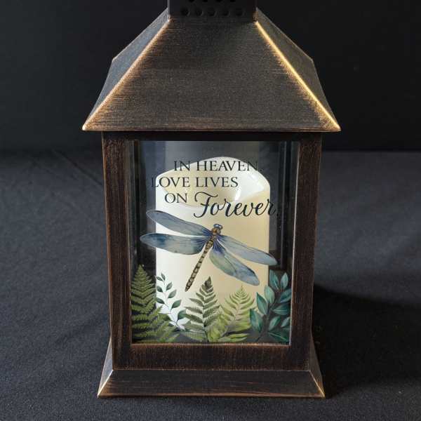 Decorative lantern with a candle and memorial text