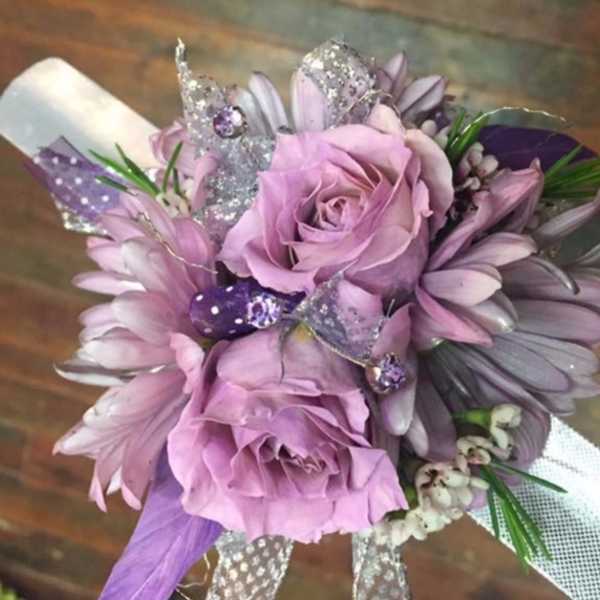 Lavender rose bouquet with purple daisies and glittery butterfly accents