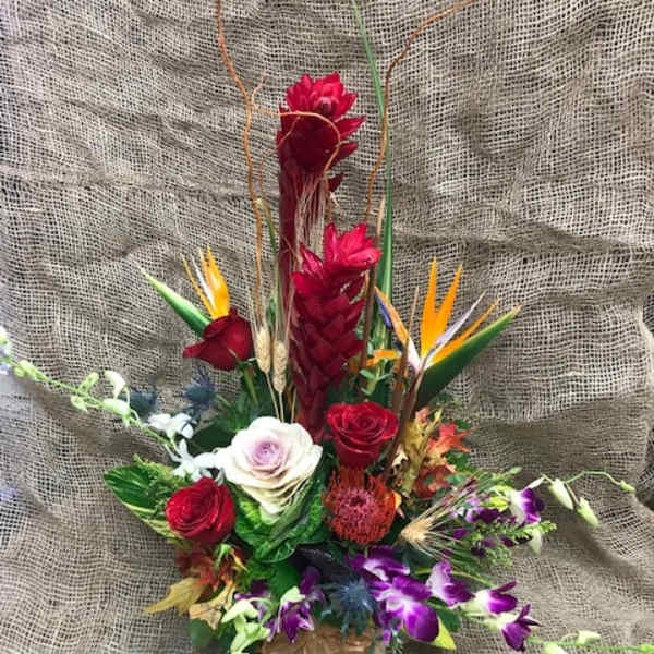 Tropical bouquet with red roses and purple orchids